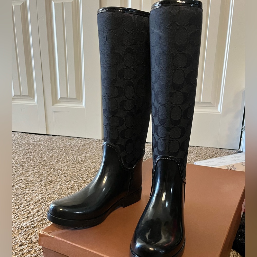 Black coach rain boots.